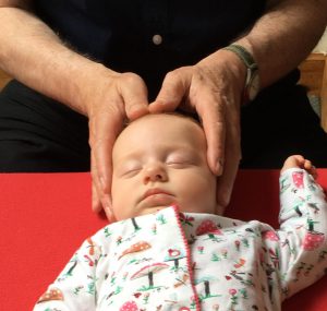 Baby having Craniosacral Therapy